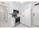 Updated kitchen featuring white cabinets, stainless steel appliances, and ample counter space at 1201 Deerfield Dr, Cary, NC 27511