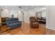 Spacious living room with hardwood floors, ceiling fan, and lots of natural light at 1201 Deerfield Dr, Cary, NC 27511