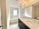 A bathroom showcasing double sinks, sleek fixtures, and bright, natural light at 128 Barclay Rd, Durham, NC 27712