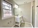 Bathroom featuring white vanity, stainless steel fixtures, and a glass-enclosed shower at 128 Barclay Rd, Durham, NC 27712