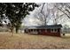 A charming single-story brick home with a covered front porch at 128 Barclay Rd, Durham, NC 27712