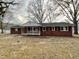 Charming single-story brick home with a welcoming front porch and classic design at 128 Barclay Rd, Durham, NC 27712