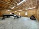 Spacious unfinished garage with ample room for vehicles, equipment, and storage at 128 Barclay Rd, Durham, NC 27712