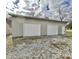 Detached two-car garage with a side entry door and durable metal siding at 128 Barclay Rd, Durham, NC 27712