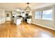 Spacious kitchen with white cabinets, stainless steel appliances, granite counters and hardwood floors at 128 Barclay Rd, Durham, NC 27712