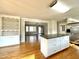 Bright kitchen with granite counters, white cabinets, stainless appliances and hardwood flooring at 128 Barclay Rd, Durham, NC 27712