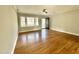 Living room with hardwood floors and a door to the exterior at 128 Barclay Rd, Durham, NC 27712