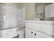 Clean bathroom features a white shower-tub combo, toilet, and vanity with chrome faucet and hardware at 1286 W Blackman Rd, Dunn, NC 28334