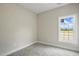 Neutral bedroom with carpet, one window letting in lots of natural light, and white trim at 1286 W Blackman Rd, Dunn, NC 28334