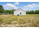 Back view of the home showing the white siding and grass lawn at 1286 W Blackman Rd, Dunn, NC 28334
