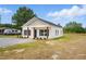 Inviting single-story home featuring white siding, a covered porch, and a neatly kept lawn at 1286 W Blackman Rd, Dunn, NC 28334