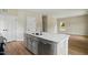Kitchen island featuring stone countertop, double sink, stainless faucet, and stainless dishwasher at 1286 W Blackman Rd, Dunn, NC 28334