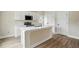 A new kitchen featuring an island with a sink and white cabinets at 1286 W Blackman Rd, Dunn, NC 28334