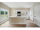 Bright kitchen features white cabinets, a central island with a sink, and modern appliances at 1286 W Blackman Rd, Dunn, NC 28334