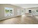 Open-concept living room featuring wood floors and view into the kitchen at 1286 W Blackman Rd, Dunn, NC 28334