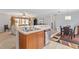 Kitchen view showcasing stainless steel dishwasher and a seamless view into the living room space at 129 Shawnee Dr, Louisburg, NC 27549