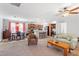 Open-concept living space featuring dining area, kitchen bar, and plush seating arrangements at 129 Shawnee Dr, Louisburg, NC 27549