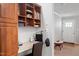 A cozy at-home office nook featuring built-in shelves and cabinets near the entryway at 129 Shawnee Dr, Louisburg, NC 27549