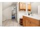 Bathroom featuring a wooden vanity with storage and a view into another room at 1304 N Duke St, Durham, NC 27701