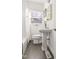Bright bathroom with tile floor, pedestal sink and shower at 1304 N Duke St, Durham, NC 27701