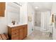 Full bathroom with a wooden vanity and a shower-tub combination at 1304 N Duke St, Durham, NC 27701