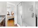 Bathroom with glass shower, granite countertop, and bedroom visible at 1304 N Duke St, Durham, NC 27701