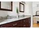Bright bathroom with double vanity, granite countertop, and wood cabinets at 1304 N Duke St, Durham, NC 27701