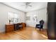 Home office with hardwood floors, writing desk, and comfortable sitting chair at 1304 N Duke St, Durham, NC 27701