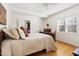 Bright bedroom with hardwood floors, ceiling fan, and decorative ceiling at 1304 N Duke St, Durham, NC 27701