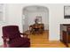 Open dining room featuring hardwood floors, an archway, and a view to an adjacent living space at 1304 N Duke St, Durham, NC 27701