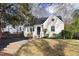 Charming home featuring classic brickwork, complemented by well-manicured landscaping at 1304 N Duke St, Durham, NC 27701