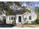 Charming home featuring classic brickwork, complemented by well-manicured shrubs at 1304 N Duke St, Durham, NC 27701