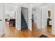 Hallway view reveals hardwood floors and many doorways, offering sightlines into adjacent rooms at 1304 N Duke St, Durham, NC 27701