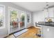 A modern kitchen island featuring seating and views of the outdoor deck at 1304 N Duke St, Durham, NC 27701