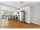 A modern eat-in kitchen featuring stainless appliances, granite countertops, and ample natural light at 1304 N Duke St, Durham, NC 27701