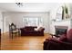 Bright living room with fireplace, hardwood floors, and natural light at 1304 N Duke St, Durham, NC 27701