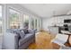 This living room boasts hardwood floors, natural light, and an open concept to a modern kitchen at 1304 N Duke St, Durham, NC 27701