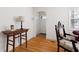 Stylish living room featuring hardwood floors and an antique table with elegant chair at 1304 N Duke St, Durham, NC 27701