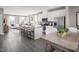 Open-concept kitchen features a large island with seating and stainless steel appliances, flowing into a cozy living area at 1364 Chowan Ave, Durham, NC 27713