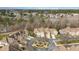 An aerial view shows the neighborhood with well-maintained landscaping and multiple car garages at 164 Arabella Ct, Cary, NC 27518