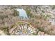 Panoramic aerial view of a luxury neighborhood, nestled around a serene lake and lush green spaces at 164 Arabella Ct, Cary, NC 27518