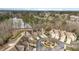Scenic aerial view of lakeside community with well-maintained landscaping and roundabout at 164 Arabella Ct, Cary, NC 27518
