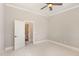 Bedroom featuring a neutral color scheme and doorway to an en-suite bath, providing a private retreat at 164 Arabella Ct, Cary, NC 27518
