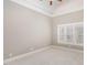 Neutral bedroom featuring bright carpet, tray ceiling and plantation shutters at 164 Arabella Ct, Cary, NC 27518