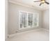 Bedroom with plantation shutters and tree-lined views, promoting a serene and private atmosphere at 164 Arabella Ct, Cary, NC 27518
