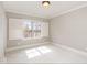Bedroom with neutral paint, bright carpet, plantation shutters and crown moulding at 164 Arabella Ct, Cary, NC 27518