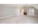 Spacious bonus room with carpet flooring and white trim and doors at 164 Arabella Ct, Cary, NC 27518