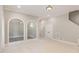 Bonus room with carpeted floors, arched openings, and white trim at 164 Arabella Ct, Cary, NC 27518
