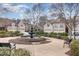 Attractive community featuring a water fountain and manicured landscaping, benches, and well maintained buildings at 164 Arabella Ct, Cary, NC 27518