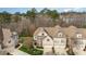 Charming multi-story home boasts brick facade, manicured lawn and convenient three-car garage at 164 Arabella Ct, Cary, NC 27518